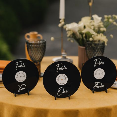 🍴Presenting you a perfect combo to organize the seating of your dear guests! Retro vinyl records table numbers along with matching seating chart will keep the vintage spirit of your party in one style. With clear printing, it conveniently guides guests to their seats, enhancing  the organization of your event. It combines practicality with elegance, making seating arrangements effortless for weddings, birthdays, and other special occasions.  Table numbers can not only be a functional element in Vinyl Wedding Table Numbers, Album Cover Table Numbers, Vinyl Records Wedding, Vinyl Table Numbers Wedding, Music Table Numbers, Record Theme Wedding, Wedding Seating Chart Records, Elvis Inspired Wedding, The 1975 Wedding