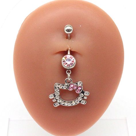 Elevate your belly piercing with our hello kitty belly ring.Material: Stainless Steel 316L Size:14 GA PRODUCT INFOAll our jewelry are made of stainless steel material. For the gold pieces, we added an 18K PVD gold plating. This means the color will last for a really long time (at least a few years). It will not fade easily and it's also an anti-scratch material.Clean your piece before wearing: wash with antibacterial soap and warm water before inserting into your piercing. If the steel jewelry h Belt Button Peircings, Hello Kitty Belly Ring, Belly Ring Jewelry, Hello Kitty Belly Button Piercing, Belly Button Piercing Hello Kitty, Hello Kitty Nose Ring, Stomach Ring, Belly Peircings Women, Hello Kitty Belly Piercing