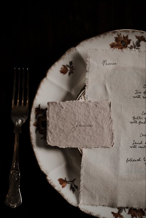 A beige place card on hand made paper with calligraphy name sits on top of a hand dyed cream cotton fabric wedding menu with hand written calligraphy. They both sit on a vintage tea plate Santa Fe, Vintage Wedding Aesthetic, Menu And Place Card, Modern Vintage Wedding, Letters To My Husband, Handwritten Wedding, Food Fair, Santa Fe Wedding, Table Inspiration