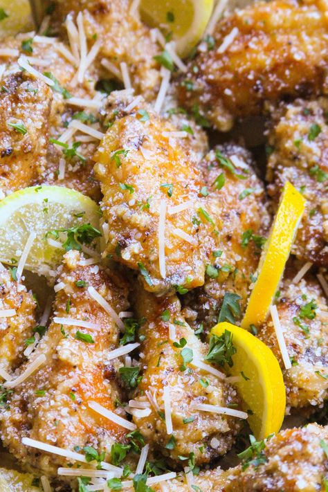 Crispy and FULL of garlic and parmesan flavor! These Easy Garlic Parmesan Wings are cooked in the air-fryer until crispy and delicious. They're juicy on the inside, and tossed in a creamy garlic parmesan sauce that will have you hollering for more! Easy Garlic Parmesan Wings, Garlic Parmesean Wings, Parmesan Wings Baked, Garlic Parmesan Wings Recipe, Parmesan Wings Recipe, Parmesan Wing Sauce, Creamy Garlic Parmesan Sauce, Parmesan Chicken Tenders, Garlic Wings