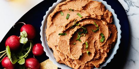 Serve this lightly spiced bean dip with tortilla chips, spread it on tacos or quesadillas, or use it as a great base for building a batch of Ultimate Nachos. Pinto Bean Dip, Easy Bean Dip, Best Superbowl Food, Bean Dip Recipe, Dairy Free Dips, Tahini Dip, Best Dip Recipes, Bean Dip Recipes, Pinto Bean