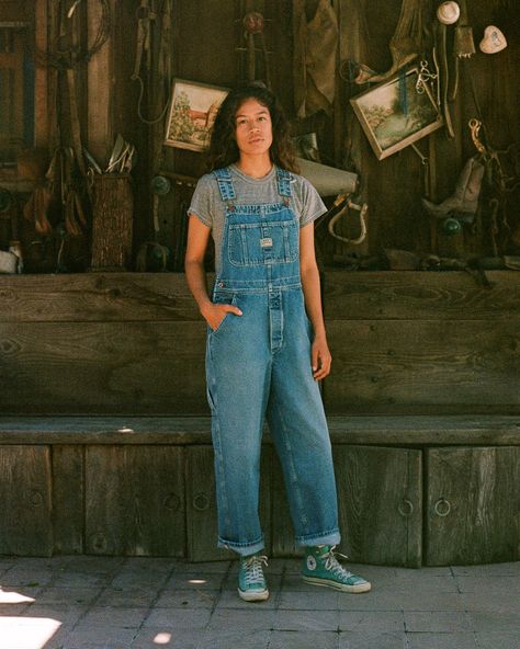 Our Unisex fit in a Vintage Washed Denim. These are a looser and roomier fit which are based off of our favorite vintage pair of overalls! These include lots of little details including green accent stitching, a carpenter loop + pocket, and triple needle stitch seams. They are designed to fit oversized. You can size down for a more fitted look if preferred. 00 / XXS (jean size 24-25) | 0 / XS (jean size 26-27) | 1 / S (Jean size 28-29) | 2 / M (jean size 30-31) | 3 / L (Jeans 31-32) | 4 / XL (jeans 33-34) | 5/ XXL (jeans 36-38) Lauren is 5'5", size 25-26 jean wearing the 1 for an oversized look Oversized Overalls Outfit, Overalls Outfit 90s, Maximalist Wardrobe, All Star Outfits, Oversized Overalls, Lifestyle Posing, Dungaree Outfit, Oversize Outfit, Overalls Vintage