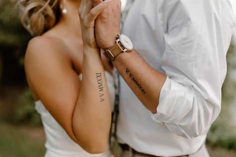 Bride and groom's arm tattoos in roman numerals Mens Roman Numeral Tattoo, Roman Numeral Tattoo Arm, Roman Numeral Date Tattoo, Wedding Date Tattoos, Married Couple Tattoos, Marriage Tattoos, Husband Tattoo, Coordinates Tattoo, Roanoke Island