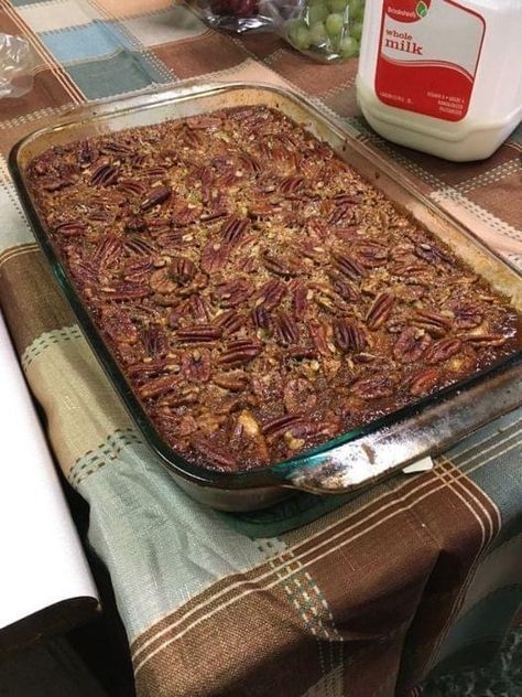 Ingredients 2 rolled refrigerated pie crusts (2 come in a package) 2-1/2 cups brown sugar 1/2 cup butter, melted + 1 Tablespoon 2-1/2 cups light corn syrup 4 teaspoons vanilla extract 6 eggs, beaten lightly 2 cups chopped pecans 1-1/2 cups pecan halves Instructions Preheat oven to 425 degrees (you will lower to 350 degrees after baking the first layer). Grease the bottom of the dish with non-stick spray. I use a 9" x 13" casserole dish. Roll out one pie crust into a rectangular shape and place Pumpkin Pecan Cobbler, Caramel Pecan Pie, Pecan Pie Cobbler, Cobbler Crust, Pecan Cobbler, Best Pecan Pie, Pecan Pies, Pecan Pie Bars, Easy To Make Desserts