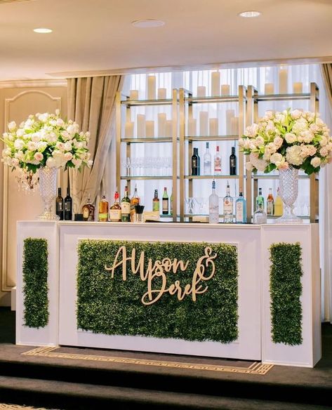 bar inspiration wedding day greenery on the front with couples names and shelves of alcohol behind with big vases and florals Wedding Juice Bar, Wedding Juice, Custom Dance Floor, Wedding Cocktail Bar, Event Venue Design, Mocktail Bar, Mobile Cocktail Bar, Catering Design, Bar Dance