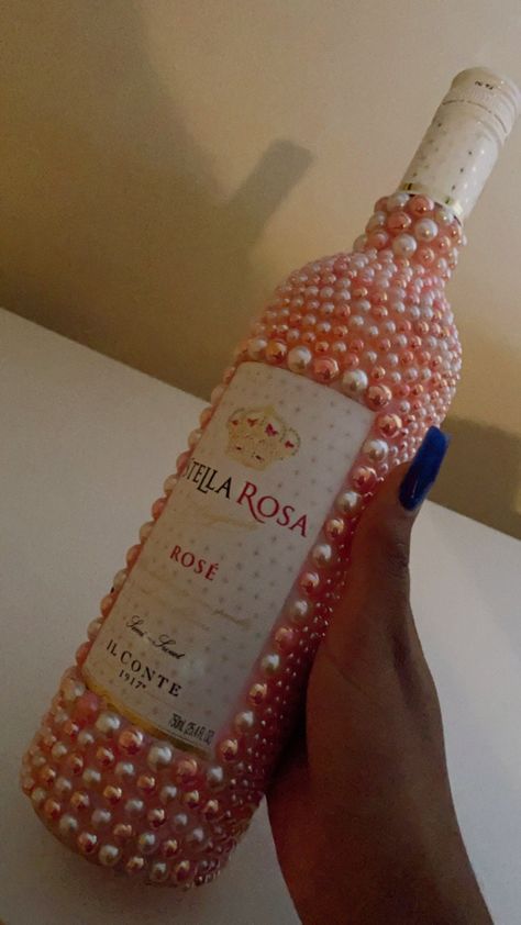 This product is a great gift for any occasion. Make your gift stand out today!  Stella Rosa pearl bottle  Price includes bottle + designs.  This bottle is all pearls with a base color. There can only be up to two pearl colors with one base color.  For the Wine(750mL) option, the wine must cost $20 or less.  Thank you for shopping with KaysKreations.  Please do not hesitate to message me with any questions or concerns. There is a 12hr-24hr response time. Decorating Wine Bottles, Diy Alcohol Gifts, Ms Krazie, Bejeweled Bottles, Blinged Bottles, Bedazzled Stuff, Alcohol Bottle Decorations, Baby Shower Bouquet, Bedazzled Liquor Bottles