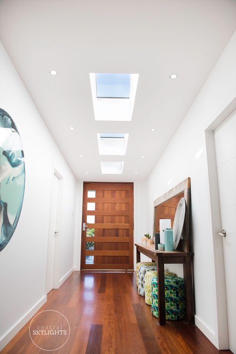 This was truely one welcoming entry way after our touch. Skylights by @coastal.skylights 📷 by @rosejanephoto  #naturallight #skylight #homeimprovement #houseinsspo #houserenovation #reno #homereno #kitchenreno #bathroomreno #housegoals #naturallightingcentralcoast #renovation #entry #frontdoor #doorspo #doorsofinstagram #centralcoast #sloarpower #velux #veluxloversoflight #veluxinstaller #veluxaustralia #ventilation #shellybeach Skylight Entrance Hall, Skylight Entrance, Hallway Skylight, Light Entrance, Skylight Design, Velux Skylights, Roof Windows, Modern Entrance, Sky Light