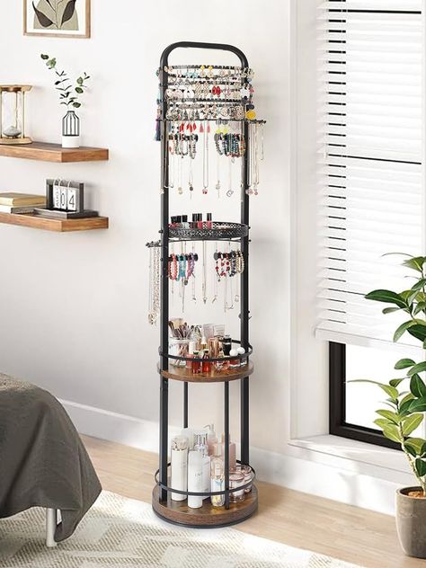 Upgrade your jewelry organization game with our versatile Floor Jewelry Holder Organizer. This rotating jewelry stand is designed to streamline your collection with dedicated holders for earrings, necklaces, bracelets, and rings. Its large hanging jewelry tree offers ample space to display and store your favorite pieces, keeping them easily accessible and tangle-free. Say goodbye to clutter and hello to organized elegance with this stylish and practical storage solution. Earring Storage, Necklace Organizer, Earring Organizer, Necklace Holder, Hanging Jewelry, Necklace Display, Practical Storage, Bracelet Ring, Large Jewelry