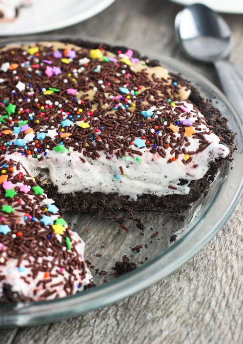 This no-bake ice cream pie with a cookie crust is an incredibly easy pie recipe without needing to turn on the oven. Oreo cookies form the crust and are topped with one or more of your favorite ice cream flavors. Top with sprinkles, whipped cream, etc. and you have dessert for a crowd! Easy Ice Cream Pie, Cookie Crust Recipe, Ice Cream Pie Recipe, Ice Cream Pie, Oh Sweet Basil, Easy Pie Recipes, Easy Ice Cream, Oreo Crust, Ice Cream Pies