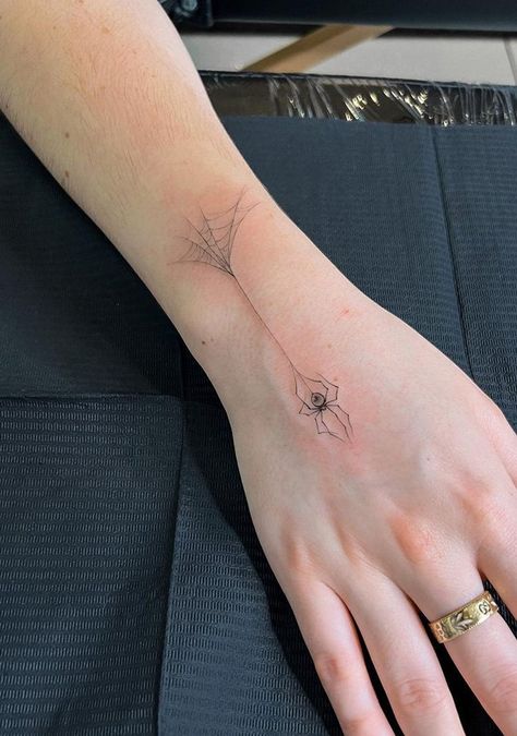 100 Wonderful Spider Tattoos ( The Newest Gallery) - The Trend Scout Spider Web Spine Tattoo, Spider On Back Tattoo, Elegant Spider Tattoo, Fineline Spider Tattoo, Hand Tattoo Spider, Abstract Spider Tattoo, Spider Tatoos Woman, Minimalist Spider Tattoo, Dainty Spider Web Tattoo