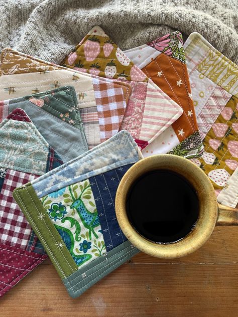 A small little pretty to help start your day with your favorite coffee. Or a special little gift for that sweet friend you share conversations with over coffee. These one of a kind pretties are made from treasured scrap fabrics. They can be used on either side-a quilted design on one and colorful coordinating prints on the reverse. They have a thick batting center for absorbency.  Each mug rug measures between 5-7 inches square . Pick your design in the drop down menu on the right.  Each photo s Cool Things To Sew, Mug Rugs Patterns Free, Coffee Quilt, Small Quilted Gifts, Quilted Mug Rugs, Mug Rug Tutorial, Quilted Coasters, Mug Rug Patterns, Small Sewing