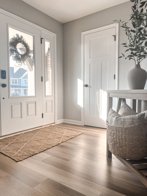 Entryway, foyer, hallway, console table, indoor rug, jute rug, front door, vase styling, summer decor, SW zircon gray, LVP flooring Rug Inside Front Door, Front Door Inside Rug, Large Entryway Rug Ideas, Front Door Indoor Rug, Front Door Indoor Rug Entryway, Front Door Rugs Indoor Entryway, Inside Front Door Rug, Indoor Rugs Front Doors, Indoor Front Door Rug