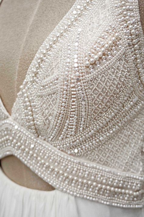 Embellished Gown Haute Couture, White Pearl Work Blouse, Beading Details Couture, White Hand Work Blouse, Pearl Embroidery Lehenga, Embroidery Details Couture, White Beaded Blouse, White Blouse With Embroidery, Bead Blouse Designs