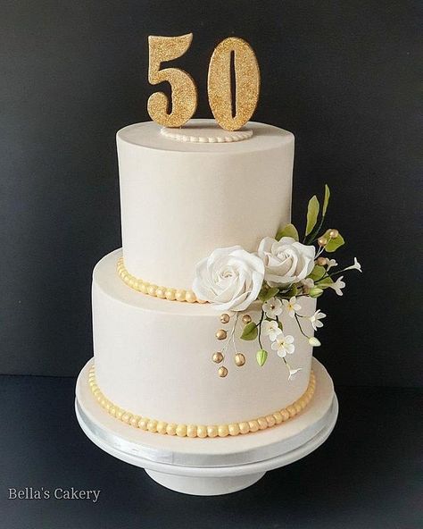 A cake to celebrate a milestone birthday. Numerical cake topper and sugar flowers made out of fondant. 50 Th Wedding Anniversary Cakes, Gorgeous Cakes Birthday, Cake For 50th Birthday For Women, 50th Anniversary Cakes Simple, 50th Cake For Women, 50 Th Birthday Cake, 50 Anniversary Cake, 50th Birthday Cakes, 50th Birthday Cake For Women