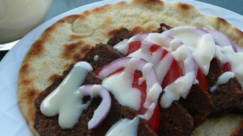 Donairs are a delicacy prevalent in the Canadian east coast, and certainly centered on the City of Halifax, they are very simple to prepare and very delicious. Fried meat slices are sandwiched in a pita round with tomato, onion, and of course, the famous Donair Sauce. Donair Sauce Recipe, Donair Meat Recipe, Donair Meat, Donair Recipe, Donair Sauce, Mediterranean Seasoning, Lamb Gyros, Gyro Recipe, Meat Recipe