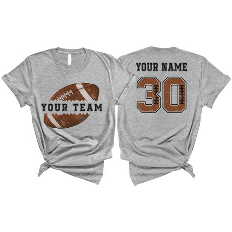 PRICES MAY VARY. PERSONALIZED T-SHIRT: A personalized Football T-shirt with name and shirt number will be the perfect gift for baseball lovers, mom, daughter, sister, niece, Wife, girlfriend,... Click on "Customize Now" and and start designing your unique shirt. MATERIAL: Solid colors are 100% cotton ( Black, White, Navy , Forest Green). Dark Heather colors are 50% cotton, 50% polyester. Sport Grey and Athletic Heather 90% cotton, 10% polyester. Color Dark Gray Heather and Heather Mauve 52% cott Football Tshirt Ideas, Baseball Girlfriend Shirts, Football Tshirt Designs, Football Girlfriend Shirts, Football Team Gifts, Custom Football Shirts, Football Girlfriend, Gifts For Baseball Lovers, Girlfriend Shirt