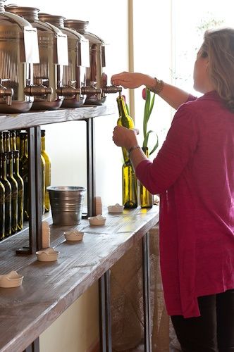 Olivette: EVOO Tasting Room & Retail in Darien — CT Bites Olive Oil Display Stand, Olive Oil Display, Olive Oil Tasting, Olive Oil Store, Bulk Store, Flavored Vinegars, Apothecary Decor, Before The New Year, Zero Waste Store