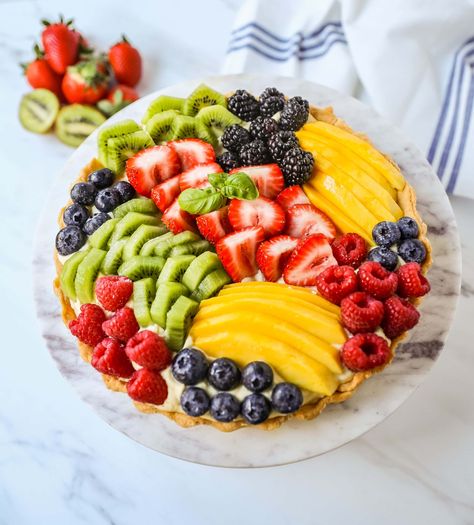 Fruit Tart with Pastry Cream This French fruit tart is made with a flaky, buttery pie crust, filled with homemade vanilla bean pastry cream, and topped with fresh fruit. Tart With Pastry Cream, French Fruit Tart, Vanilla Pastry Cream, Fresh Fruit Tart, Buttery Pie Crust, Pastry Cream, Fruit Tart, Homemade Vanilla, Pie Crust