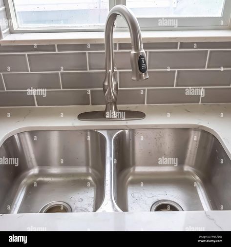 Download this stock image: Square frame Double bowl stainless steel sink undermounted on the white kitchen countertop - W6CFDW from Alamy's library of millions of high resolution stock photos, illustrations and vectors. White Tile Kitchen Floor, Cozy Kitchen Decor, White Kitchen Floor, Kitchen Tiles Design, Kitchen Decor Inspiration, Aesthetic Kitchen, Stainless Steel Kitchen Sink, Cozy Kitchen, Kitchen Floor Tile