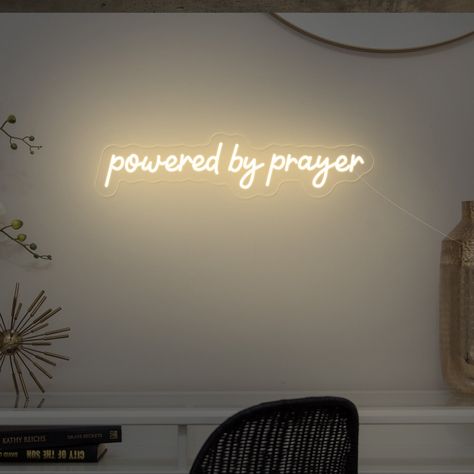 "Powered By PrayerNeon Sign" is a radiant expression of faith. Elevate your space with this captivating Bible verse wall decor, designed for Christians and Jesus enthusiasts. This neon sign serves as a thoughtful gift, bringing a touch of spiritual inspiration to any home. Let the warm glow of faith illuminate your surroundings with this stylish and meaningful piece of religious art. Embrace the divine message and create a space that reflects your unwavering trust in the Lord. Perfect for those Go To Church Aesthetic, Bible Verse Neon Sign, Bible Bedroom Decor, Faith Wall Art, Christian Decorations Home, Christian Neon Signs, Christian Home Aesthetic, Christian Esthetics, Jesus Room Decor