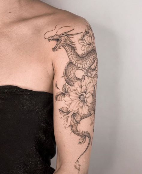 Dragon Tattoo | Tattoo Ideas and Inspiration | miriamandrea_ink Tattoo Brazo Mujer, Tattoo Pequeños Mujer, Dragon Tattoo With Flowers, Dragon Tattoo Shoulder, Black Dragon Tattoo, Dragon Tattoo Arm, Shoulder Sleeve Tattoos, Around Arm Tattoo, Dragons Tattoo