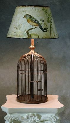 20 Lovely Repurposed Bird Cages | Daily source for inspiration and ...  (darling look, but imagine the dust it would collect) Birdcage Lamp, Cage Table, Bird In A Cage, Unique Table Lamps, Bird Cage Decor, Deco Boheme, Bird Cages, Vintage Diy, Bird Decor