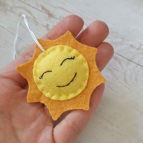 ☀️ Brighten up your day with this little ball of sunshine! 🌞 Yep, you guessed it right - I whipped up this adorable felt sun ornament all by myself, and let me tell you, it's got more personality than your average ray of sunshine! 😄 Imagine waking up to this cheery face hanging on your Christmas tree or adorning your little one's bedroom - instant mood lift guaranteed! Plus, it's handmade with love and bursting with charm, just like you! 💖 So, if you're ready to add some sunny vibes to your... Felt Sun, Desert Habitat, Sun Ornament, Desert Christmas, Felt Ornaments Patterns, Sunny Vibes, All By Myself, Ray Of Sunshine, Felt Toys