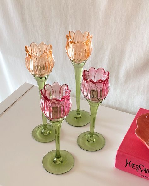 Enhance the ambiance of any space with our charming Tulip Flower Glass Candle Holder. Oh-so delicate, its design evokes the beauty and serenity of colorful tulip flower fields. The translucent glass gently diffuses the candlelight, casting a soft and inviting glow. With its elegant silhouette and intricate detailing, this candle holder adds a touch of sophistication to any decor. Whether used as a centerpiece on a dining table, an accent on a mantel, or to create a relaxing atmosphere in a bath, Fake Food Home Decor, Fruit Candle Holder, Tulip Home Decor, Stained Glass Table Decor, Cottage Core Table Decor, Floral Brunch Decor, Tulip Candle Holder, Flower House Decor, Dopamine Kitchen Decor