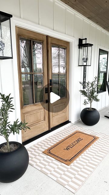 Michelle Anzaldua | Thecozyfarmhouse on Instagram: "Happy March! Simple spring porch 🍃  I love simplicity so I kept it simple on the porches too.   #porch #porchdecor #porchlife #porchview #doubledoors" Farmhouse With Wood Porch, Modern Farmers Porch, Small Front Porch Modern Farmhouse, Farmhouse Front Porch Lights, Modern Farmhouse Porch Ideas, Front Porch Rockers Farmhouse, Front Porch Rocking Chairs Farmhouse, Modern Farmhouse Porch, Modern Front Porches