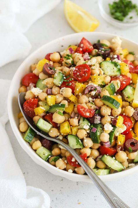 This easy Mediterranean Chickpea Salad combines colorful fresh veggies and a simple vinaigrette for a delicious, healthy side dish. We love using this Greek chickpea salad for meal prep lunches, paired with some grilled chicken or salmon for extra protein. This no lettuce salad doesn't get soggy and packs beautifully for work lunches, but also makes a delicious, fresh bbq side dish in the summer. Naturally gluten-free & vegan-friendly, it's great for a crowd! No Lettuce Salad, Meal Prep Lunches, Bbq Side Dish, Greek Chickpea Salad, Lettuce Salad Recipes, Mediterranean Chickpea, Greek Chickpeas, Mediterranean Chickpea Salad, Bbq Side