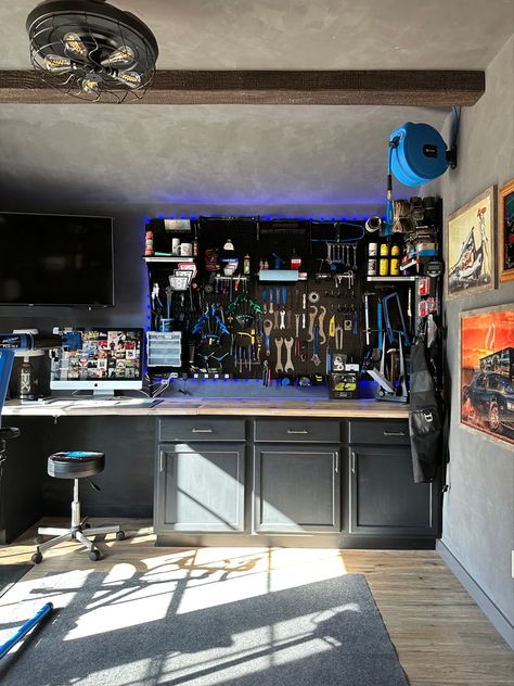 Built my husband a man cave/bike shop and now he’s always in here working! The faux beams came from @ekenamillwork and for the tool wall i used @wallcontrol. #bikeshop #mancave #mancaveideas #fauxromanclay #romanclay #walltexture #workshop #toolorganization #toolwall #wallcontrol Diy Man Cave, Officine In Garage, Tool Wall Storage, Roman Clay, Small Man Cave, Bicycle Garage, Cave Design, Unfinished Cabinets, Man Cave Shed