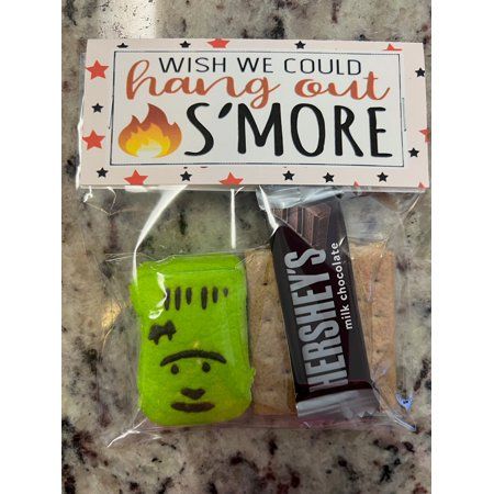 Prepare for a spooktacular Halloween with our Spooky S'mores Halloween Treat Bags, the perfect treat for goblins, ghosts, and ghouls of all ages! These adorable bags are filled with all the essential S'mores ingredients you need for a sweet and hauntingly delicious experience. What's Inside: - Mini Hershey's Milk Chocolate Bar: Rich and creamy, it's the perfect chocolatey foundation for your S'mores creation. - Peeps Marshmallow Ghost, Pumpkin, Monster and Sugar Skull: These ghostly marshmallows Smores Baggies, Smores Bags Favors, Halloween Smores Treat Bags, Halloween Treat For Coworkers, Adult Halloween Goodie Bags, Smores Treat Bags, Halloween School Treats Bags, Halloween Gift Bag Ideas, Halloween Party Favors For Kids