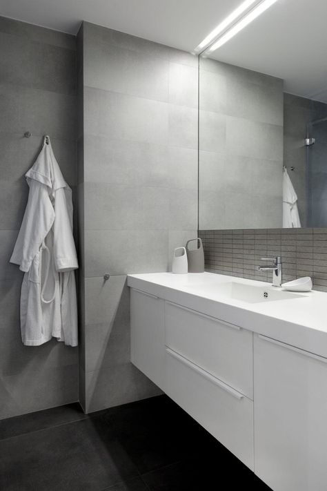 E2 Apartment by Tchenguelieva Staynov Architects Bathroom With Light Grey Tiles, Bathroom Light Grey Tiles, Light Grey Bathroom Ideas Modern, Light Grey Modern Bathroom, Chrome Tapware Bathroom, Grey And Chrome Bathroom, Grey And Marble Bathroom, Light Grey Marble Bathroom, Light Grey And White Bathroom