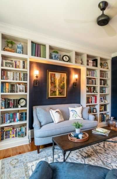 35 Built-In Bookshelves Design Ideas | Sebring Design Build Reading Nook With Built In Bookshelves, Ideas For Built In Bookshelves, Inbuilt Bookshelves Built Ins, Couch Surrounded By Bookshelves, Built In Bookshelves Around Sofa, Wall Built In Bookshelves, Open Back Built In Bookshelves, Couch With Bookshelves On Either Side, Built In Bookshelves Reading Nook