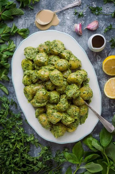 A platter of potato salad with tahini herb dressing surrounded by herbs. Vegan Tahini Dressing, Potato Salad With Apples, Bread Desserts, Salad Recipes With Bacon, Comfort Food Meals, Potato Salad Dill, Party Side Dishes, Potato Salad Dressing, Herb Dressing