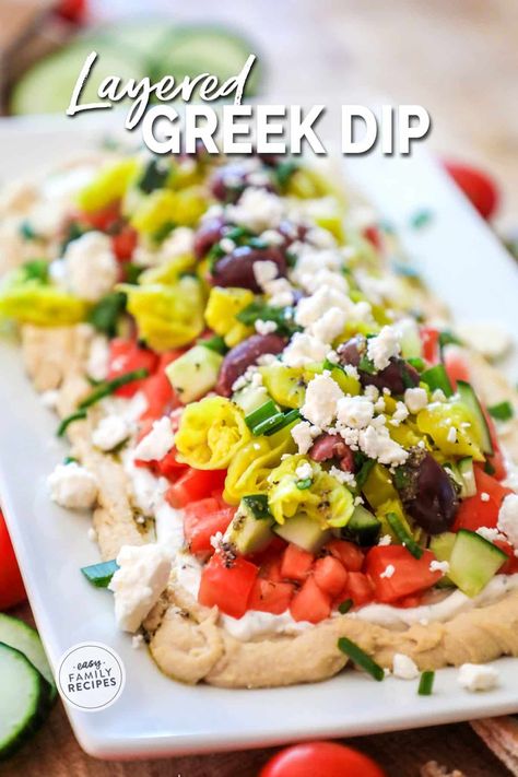 This is THE BEST DIP RECIPE EVER! This easy layered greek dip is quick to make, requires no cooking, and people rave about it every time it is served. It is kind of like a seven layer greek dip where all of the ingredients are layered on top of each other to form a fresh, healthy party dip perfect for an appetizer or neighborhood BBQ. Serve this easy greek layer dip with fresh pita or chips. 7 Layer Hummus Dip, 7 Layer Greek Hummus Dip, Greek Dip 7 Layer, Greek Layered Hummus Dip, Greek Salad Dip, Greek Appetizers Parties Food, Greek Finger Food, Greek Appetizers Easy, Greek 7 Layer Dip