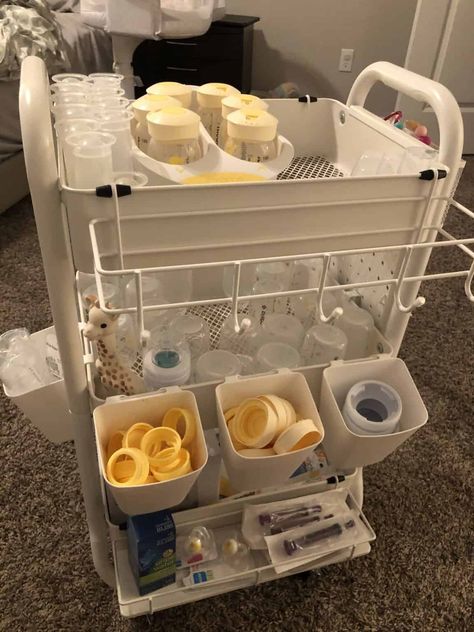 Clever Baby Bottle Organization Ideas - One Sweet Nursery Baby Bib Storage, Rolling Cart For Nursery, Baby Trolley Organiser, Rolling Cart Organization Baby, Organizing Baby Bottles In Kitchen, Breastfeeding Cart Organization, Baby Bottle Storage Kitchen, Baby Cart Organize, Newborn Rolling Cart