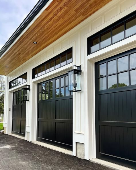 Modern Farmhouse Garage Doors Black, Black Double Garage Doors, Black Wood Garage Doors, Garage Doors Modern Farmhouse, Black Garage Doors With Windows, Black Garage Door With Windows, Garage Doors On White House, White Oak Garage Door, Painting Garage Door Black