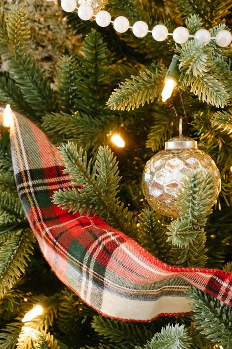 A Christmas tree filled with cozy flannel plaid ribbon, traditional pearl beaded garland and loads of beautiful mercury glass and mixed metal ornaments to create a vintage inspired Christmas tree with a cozy + nostalgic feel for the holidays. #vintagechristmas #christmastree #cozychristmastree #mercuryglass #mercuryglasschristmas #plaidchristmasdecor #nostalgicchristmasdecor #christmastreedecoratingideas Vintage Plaid Christmas Tree, Red Green Plaid Christmas Tree, Christmas Trees With Plaid Ribbon, Ralph Lauren Christmas Tree Ideas, Christmas Tree With Plaid Ribbon, Christmas Tree Plaid Ribbon, Red And Green Plaid Christmas Tree, Plaid Decorated Christmas Tree, Christmas Tree Plaid Theme