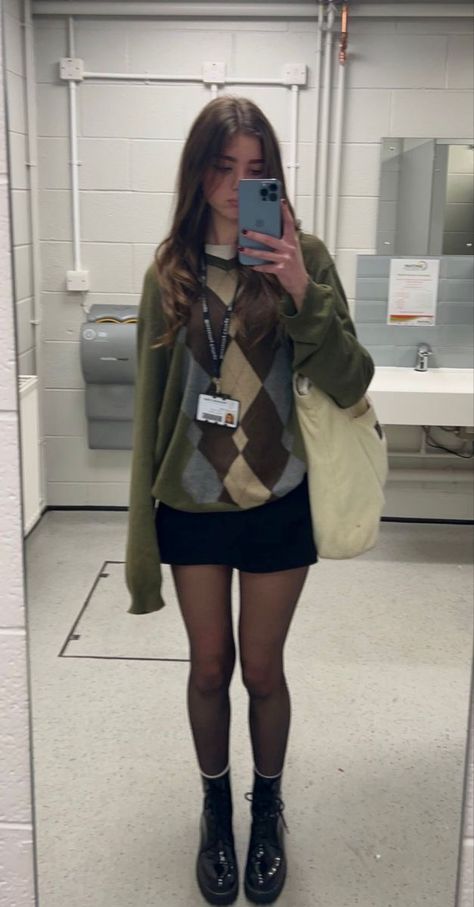 Green Argyle Sweater Outfit, Sweater And Skirt Outfit 90s, Cute Sweater Skirt Outfits, Skirt And Jumper Outfit Aesthetic, Sixth Form Outfits Doc Martens, Layered Jumper Outfit, Brown Skirt And Sweater Outfit, Black Skirt Outfit Aesthetic Grunge, Black Jumper Skirt Outfit