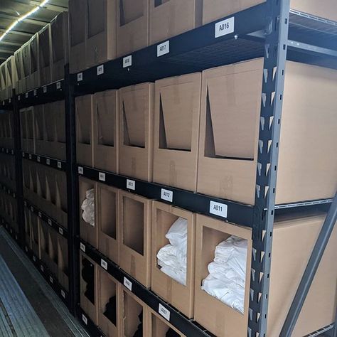 Stock Organization Storage, Retail Storage Organization, Warehouse Shelving Storage, Retail Backroom Organization, Godown Storage Ideas, Boutique Warehouse Organization, Small Business Stock Organization, Warehouse Organization Inventory, Clothing Inventory Storage