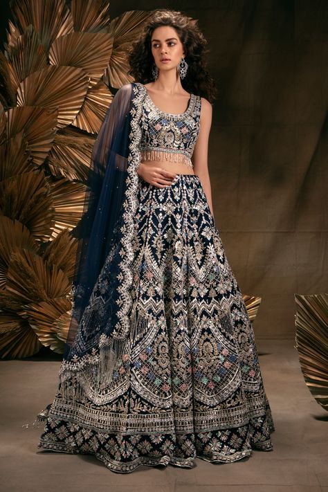 NAVY BLUE LEHENGA SET WITH MULTI COLOURED EMBROIDERY AND GOTA WORK PAIRED WITH A MATCHING SCALLOPED DUPATTA AND BEADED TASSELS. - Seasons India Reception Lehenga Bridal Indian, Blue Indian Wedding Dress, Reception Lehenga Bridal, Blue Indian Wedding, Blue Bridal Lehenga, Indian Wedding Reception Outfits, Royal Blue Lehenga, Navy Blue Lehenga, Wedding Reception Outfit