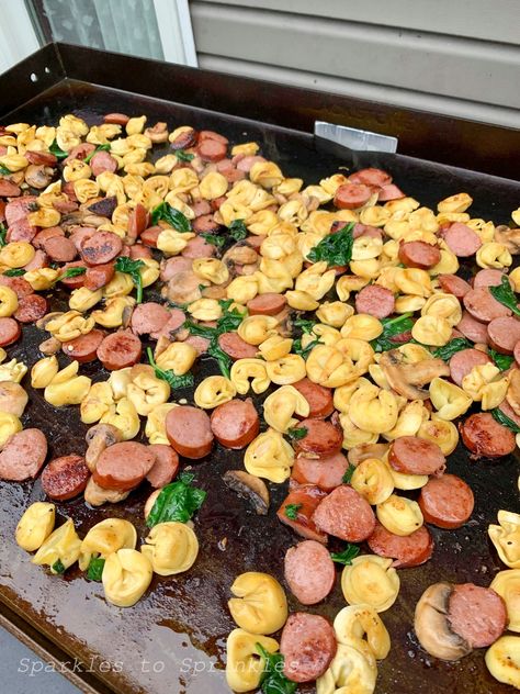 Blackstone Grilled Kielbasa, Tortellini, & Spinach Casserole is full of flavor and so easy to make. This easy recipe will be your favorite! Kielbasa Tortellini, Food On The Grill, Grilled Kielbasa, Outdoor Griddle Recipes, Griddle Cooking Recipes, Outdoor Cooking Recipes, Blackstone Recipes, Spinach Casserole, Kielbasa Recipes