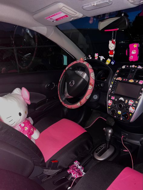 Hello kitty Hello Kitty Car Interior Aesthetic, Car Theme Ideas Interior, Hello Kitty Car Inside, Hello Kitty Car Decorations, Car Decorations Interior Y2k, Black And Pink Car Interior Aesthetic, Car Decorations Interior Hello Kitty, Mcbling Car Interior, 2000s Car Aesthetic