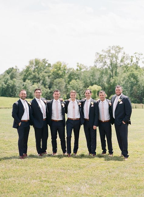 This pastel wedding with a two-piece bridal gown has us saying ooh la la! #flowyweddinggowns #chicbarnweddingreception #fineartwedding #twopieceweddingdress Mens Black Wedding Attire, Groomsmen Attire Pocket Square, Groomsmen Attire Black And Pink, Black And Pink Groomsmen Attire, Black And Blush Groomsmen Attire, Black Suit With Blush Pink Tie, Groomsmen Black Suit Pink Tie, Navy And Pink Groomsmen, Black Suit Pink Tie Wedding