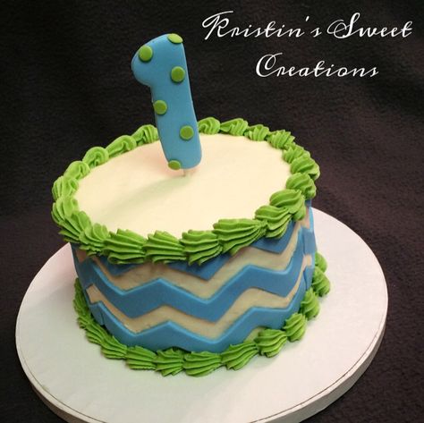 Blue, green, and white chevron smash cake for a 1st birthday! First Birthday Cake Blue, Puppy Birthday Cakes, Chevron Cakes, Blue Birthday Cakes, Cake Boy, Cookie Cake Birthday, Smash Cake Boy, Elegant Birthday Cakes, Twins 1st Birthdays