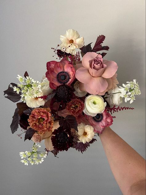 Dark and moody bouquet for a fall bride! Mauves, deep reds, browns, with whites and creamy pinks Dark Spring Bouquet, Moody Floral Centerpiece, Dogwood Wedding Flowers, Fall Pink Wedding Flowers, Maroon And Pink Flowers, Dark Wedding Flowers Bouquet, Dark Color Flowers, Dark Bride Bouquet, Deep Red Flowers Wedding