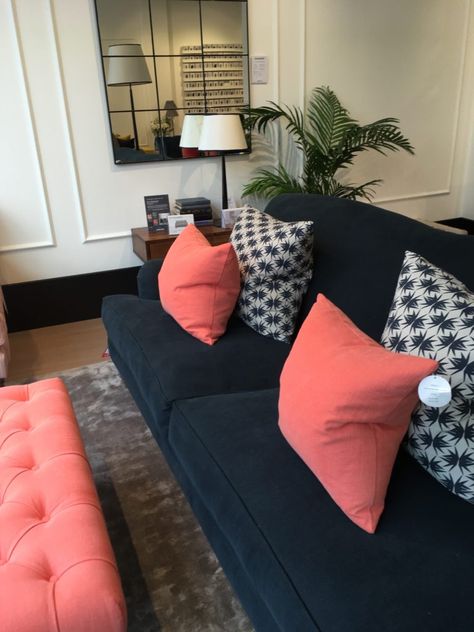 Love the coral/orange scatter cushions with the dark navy Navy Coral Living Room, Navy And Coral Living Room, Navy Coral Bedroom, Coral Living Room, Dark Blue Couch, Townhome Decor, Tropical Room Ideas, Coral Living Rooms, Coral Sofa