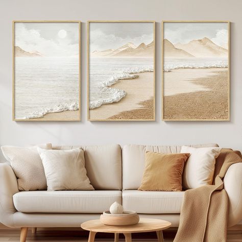 PRICES MAY VARY. [Framed Wall Art]: Set of 3 framed neutral coloured abstract beach wall art, each measuring 16x24 inches. Frames are made of durable, rust-resistant metal and finished in a natural wood colour to simulate the texture of real wood. [Canvas Artwork for Walls]: Our 2D prints artwork is made of waterproof canvas which is waterproof and easy to maintain. The canvas has a unique texture that enhances the visual effect of the image, saturates the colours, keeps the painting colourful f Modern Minimalist Coastal Decor, Large Framed Canvas Wall Art, Painting Ideas On Canvas 3 Piece, Above The Bed Artwork, Coastal Chic Home Decor, Picture Frames Above Couch, Behind Sofa Wall Decor, Boho Beach Living Room, Wall Art Living Room Decor Ideas