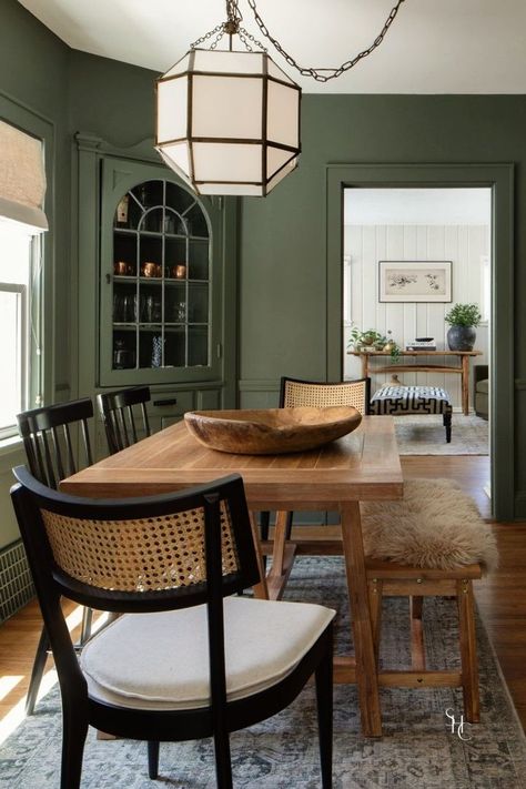 Searching for dark or olive green dining room ideas? Check out this dark green dining room walls featured in our Franklin Refresh design featuring wooden table and black chairs. See more at www.stonehousecollective.com Green Dining Room Walls, Moody Dining Room, Room Ideas Dark, Dark Dining Room, Olive Green Walls, Green Dining Room, Dark Green Walls, Suzanne Kasler, Dining Room Paint